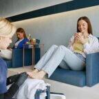 Nail salon appointment representing increased guest spending with packages