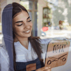 Salon and spa owner with an open sign, representing the switch to a better software