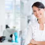 Smiling business owner representing the future of beauty salon business trends